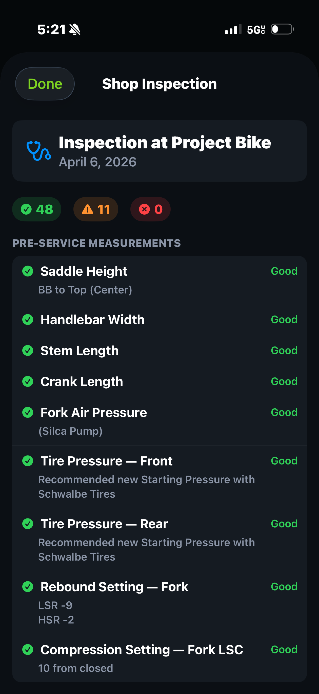 Shop inspection from Project Bike on Trail Hits iPhone app: 48 good, 11 attention, 0 issues across saddle height, handlebar width, fork air pressure, tire pressures, rebound and compression settings
